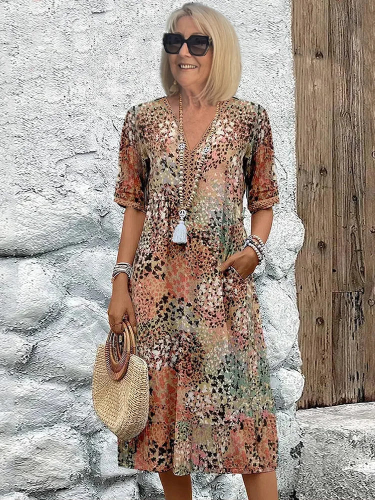 Damen Kleid mit V-Ausschnitt | Knielänge und Musterdesign